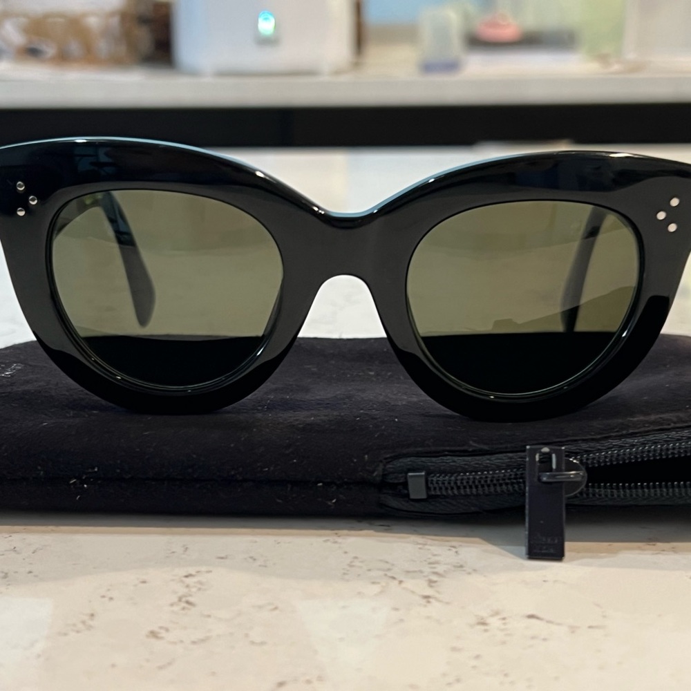 Authentic Celine (original) round cat-eye sunglasses, black frames, green lens.